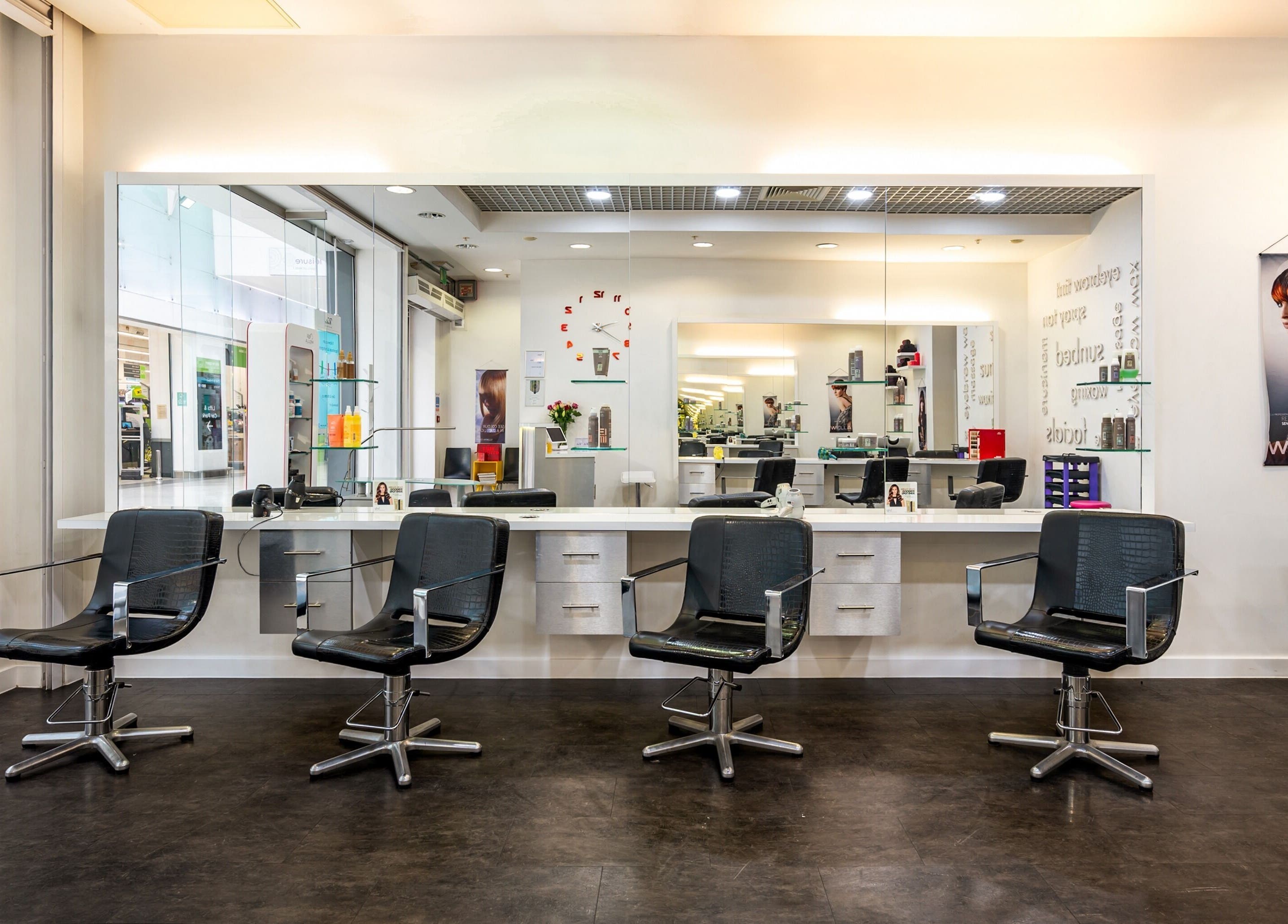 Modern salon chairs at Vida Hair & Beauty The Mercury, Romford, England, GB showcasing elegant design.