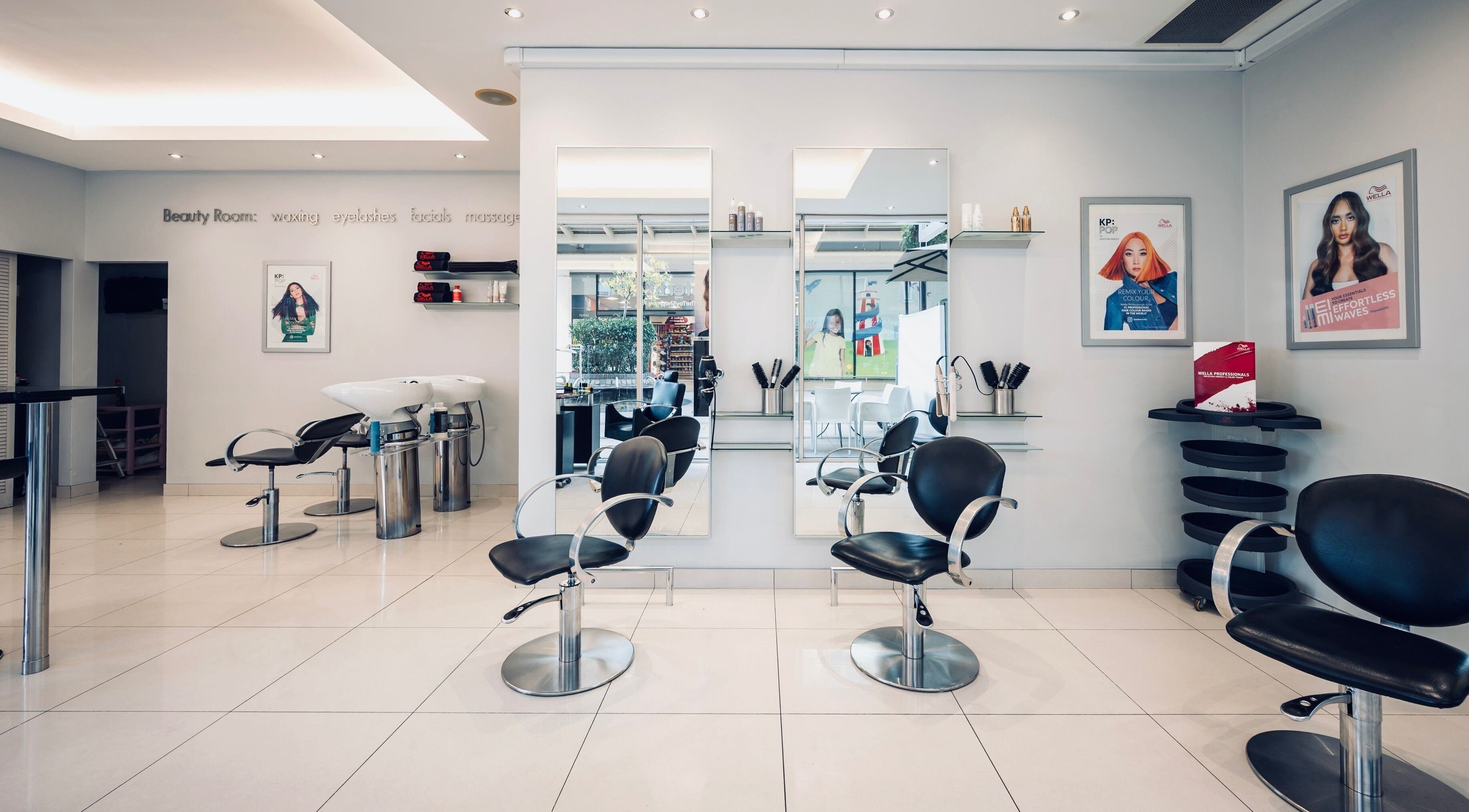 Modern interior of Vida hair & beauty The Brewery, Romford, England, GB, showcasing sleek salon chairs and mirrors.