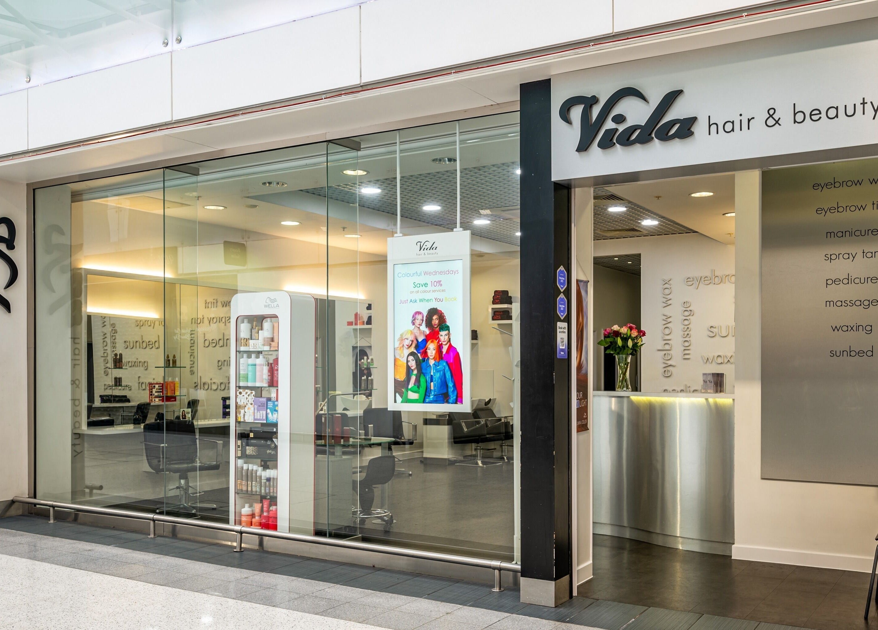 Front view of Vida Hair & Beauty The Mercury, Romford, England, GB, showcasing modern entrance design.