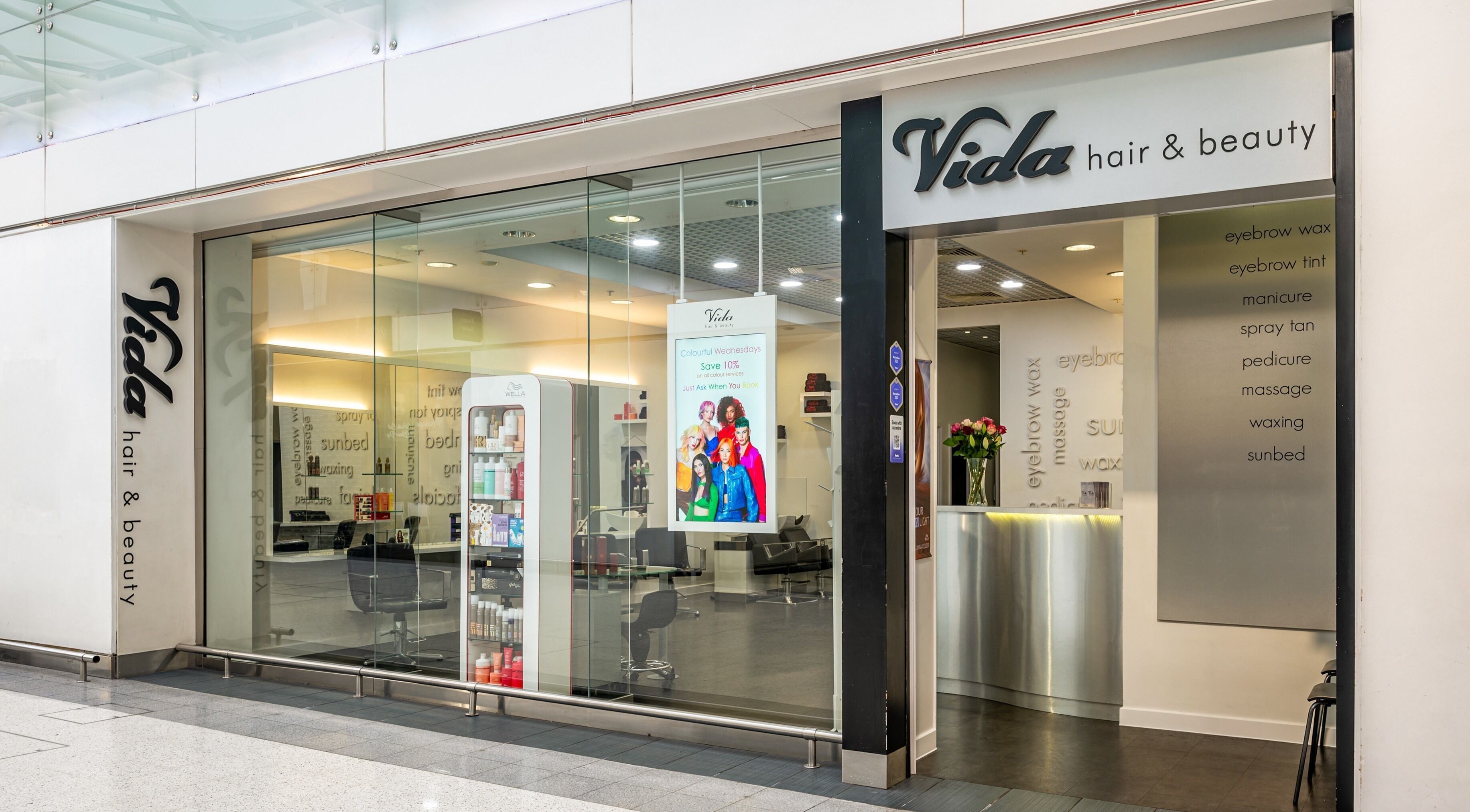 Front view of Vida Hair & Beauty The Mercury, Romford, England, GB, showcasing modern entrance design.