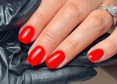 Vibrant red manicure by Cara Jade Beauty in Wells, England, GB, showcasing elegance and style.