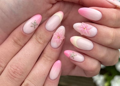 Elegant pink floral gel nails at Cara Jade Beauty in Wells, England, GB. Perfect for a chic, modern look.