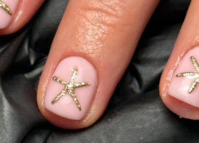 Elegant star-themed nail art at Cara Jade Beauty, Wells, England, GB, showcasing intricate design.