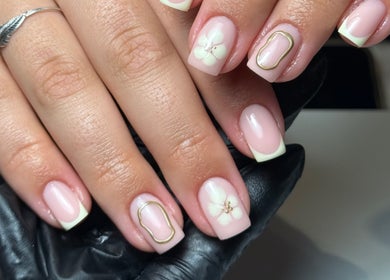Elegant floral nail art at Cara Jade Beauty in Wells, England, GB showcasing intricate design.