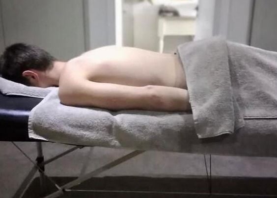 Relaxing massage at Rose Mobile Massage in Cape Town, Western Cape, ZA with a person lying on a massage table.