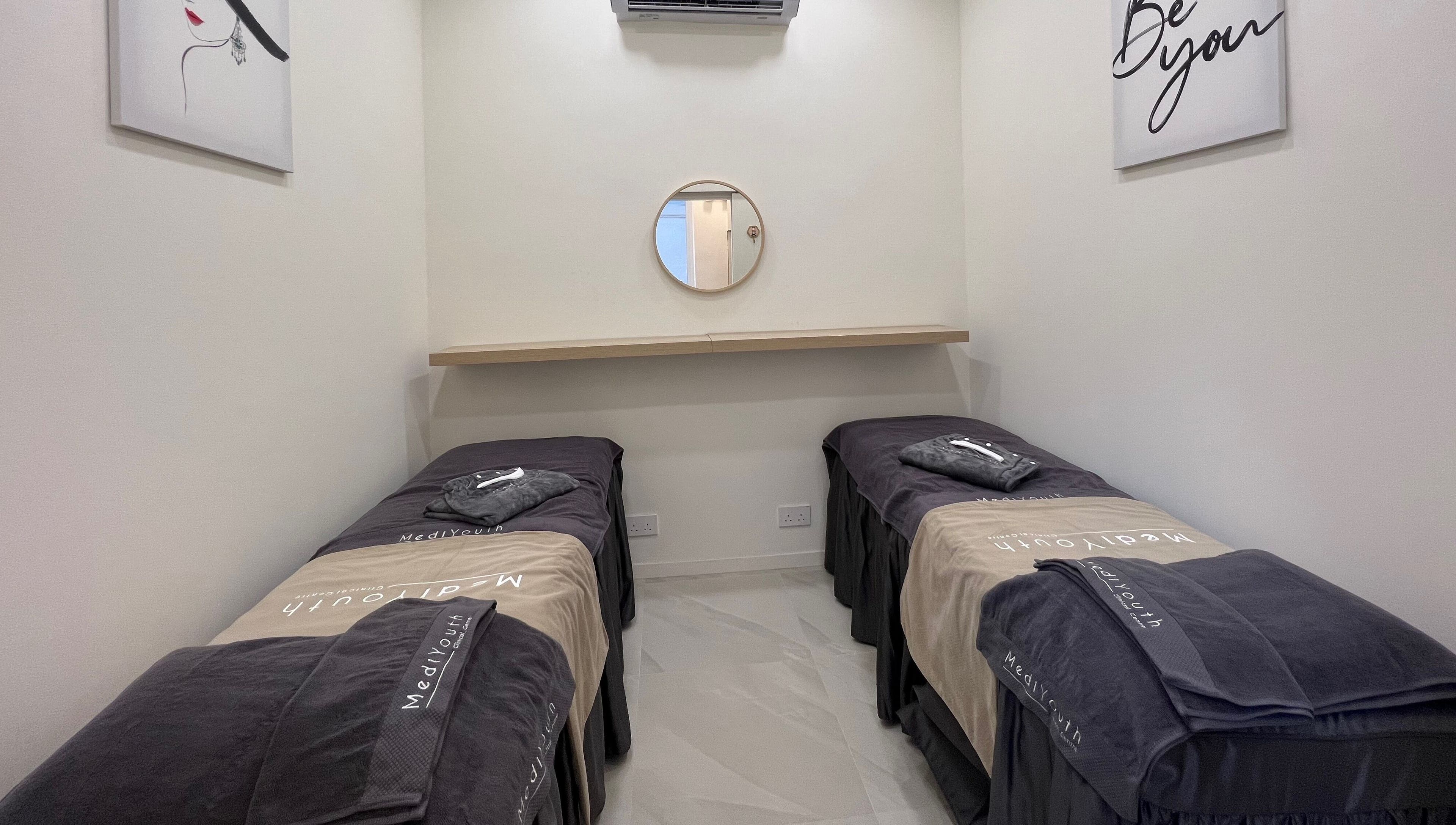 Tranquil treatment room at MediYouth Clinical Centre Central on Hong Kong Island, HK with two spa beds.