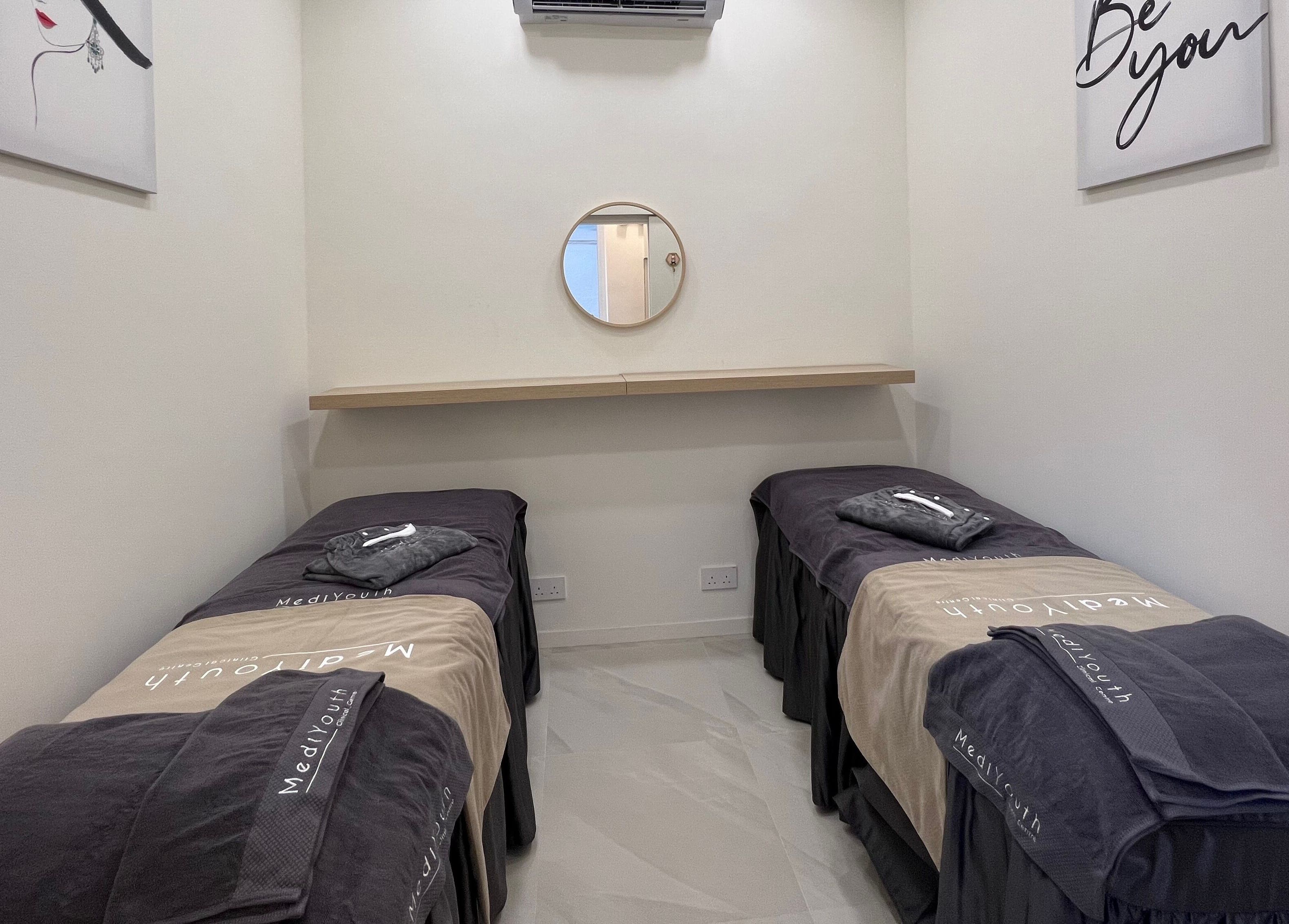 Tranquil treatment room at MediYouth Clinical Centre Central on Hong Kong Island, HK with two spa beds.