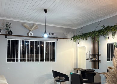 Modern salon interior at Stylist de Beleza, Pretoria, Gauteng, ZA featuring stylish decor and elegant lighting.