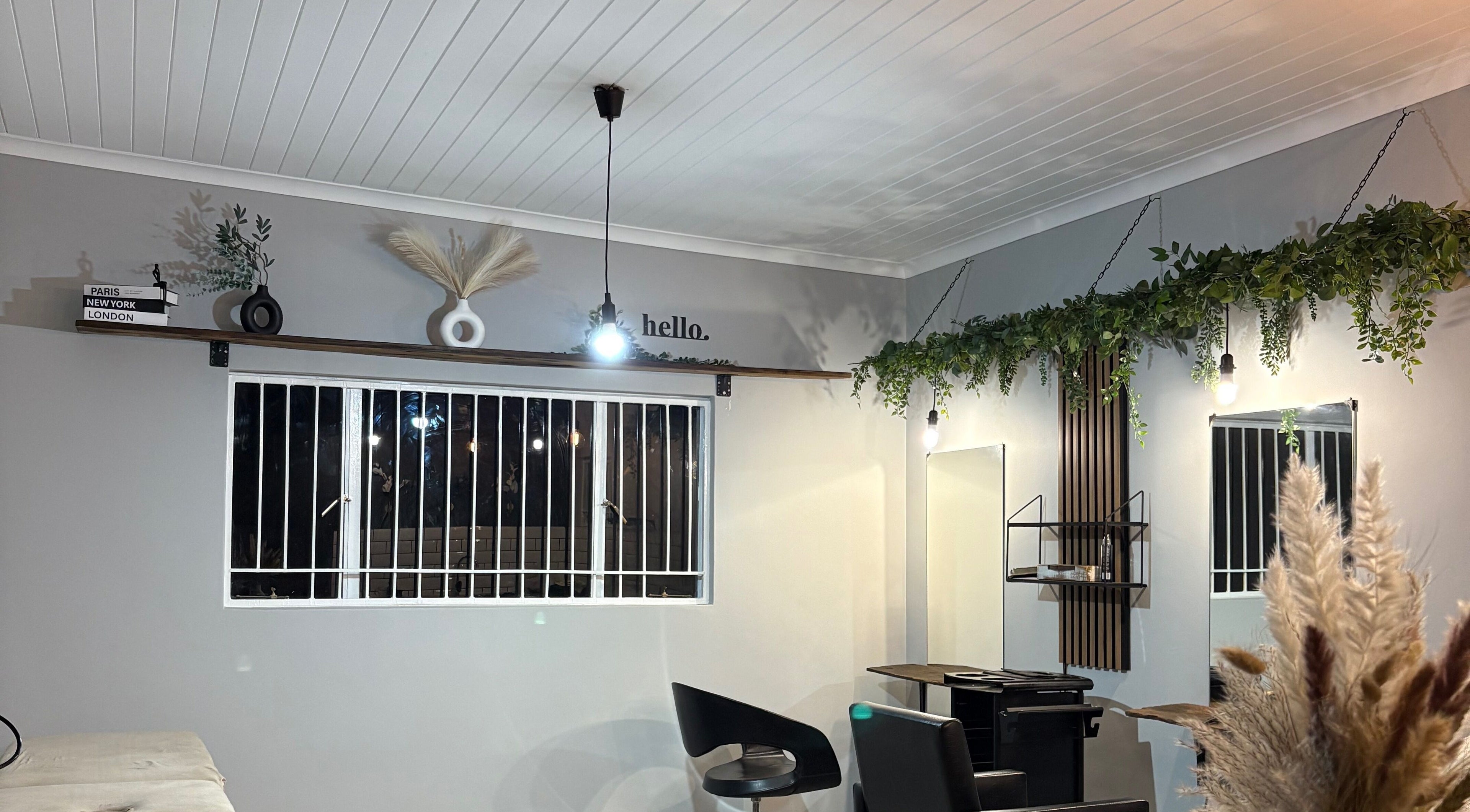 Modern salon interior at Stylist de Beleza, Pretoria, Gauteng, ZA featuring stylish decor and elegant lighting.