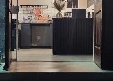 Modern salon interior at Stylist de Beleza in Pretoria, Gauteng, ZA showcasing elegant design and warm ambiance.