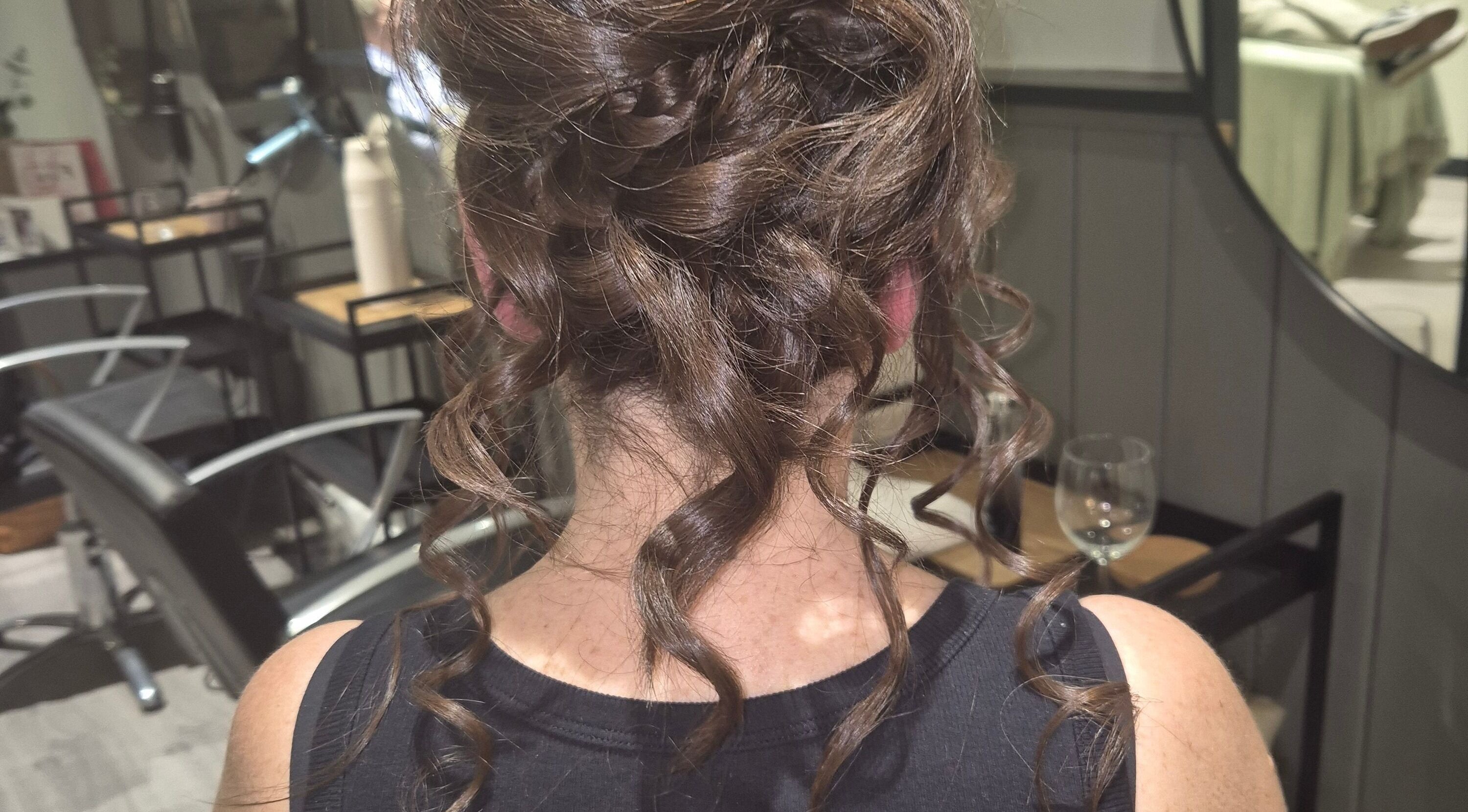 Stunning hairstyle at Salon De Lyla, Ludgershall, England, GB showcases intricate curls and elegant updo.