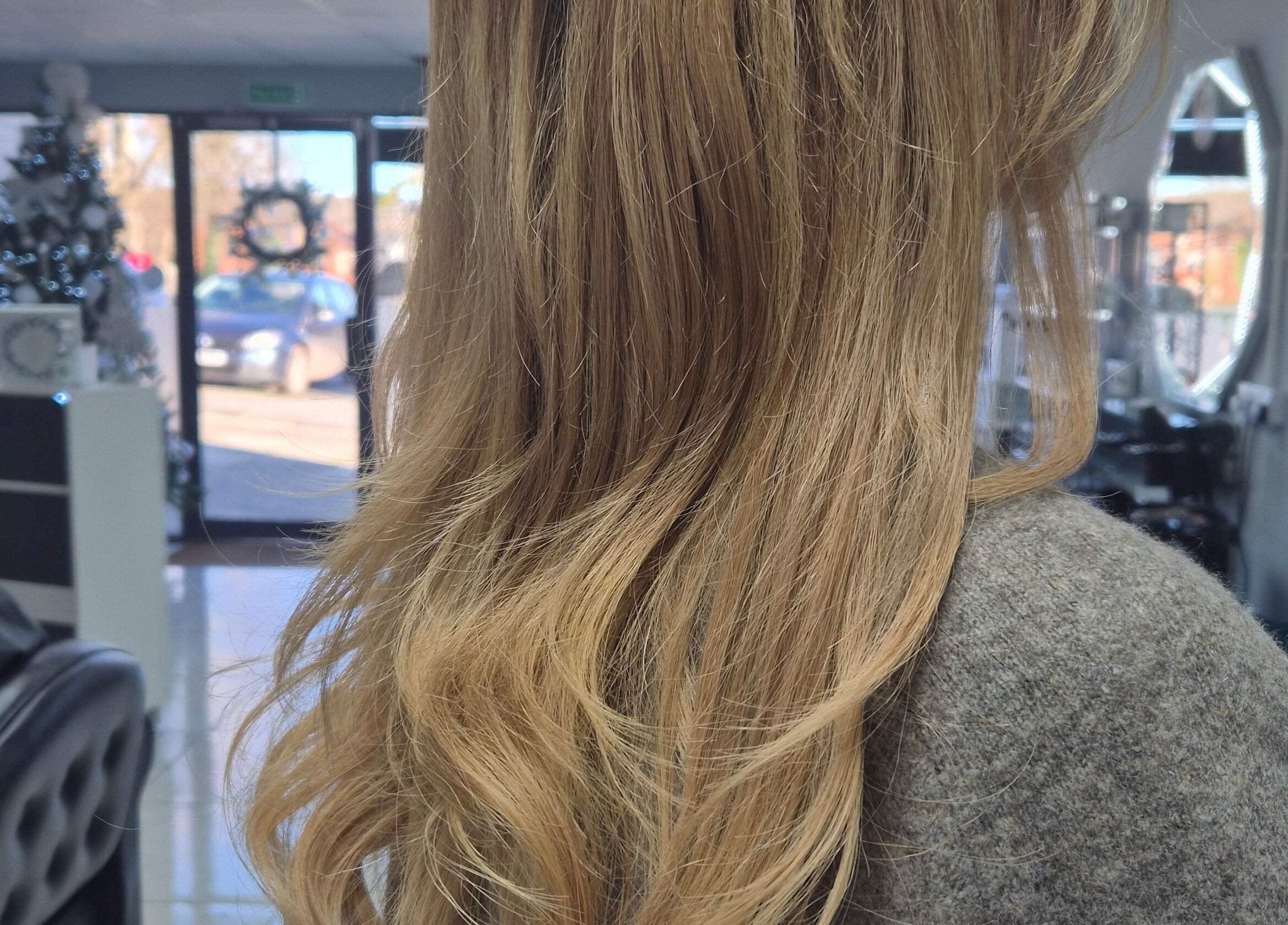 Stylish wavy hair at Salon De Lyla, Ludgershall, England, GB. Luxurious salon interior visible.