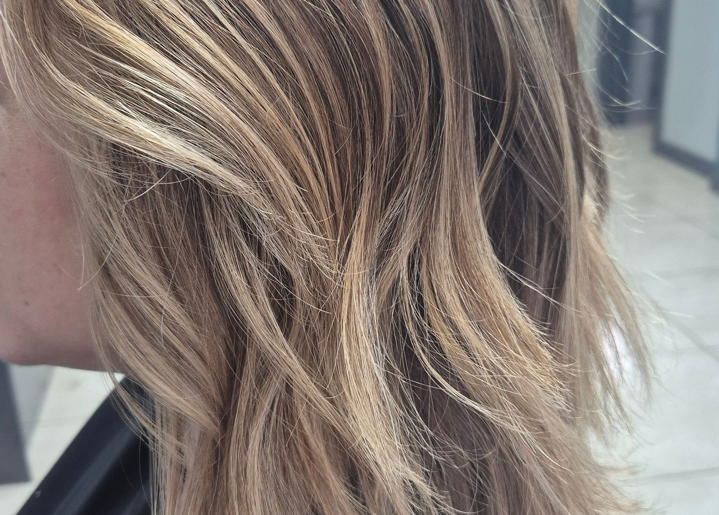 Close-up of stylish blonde hair at Salon De Lyla, Ludgershall, England, GB, showcasing expert styling.