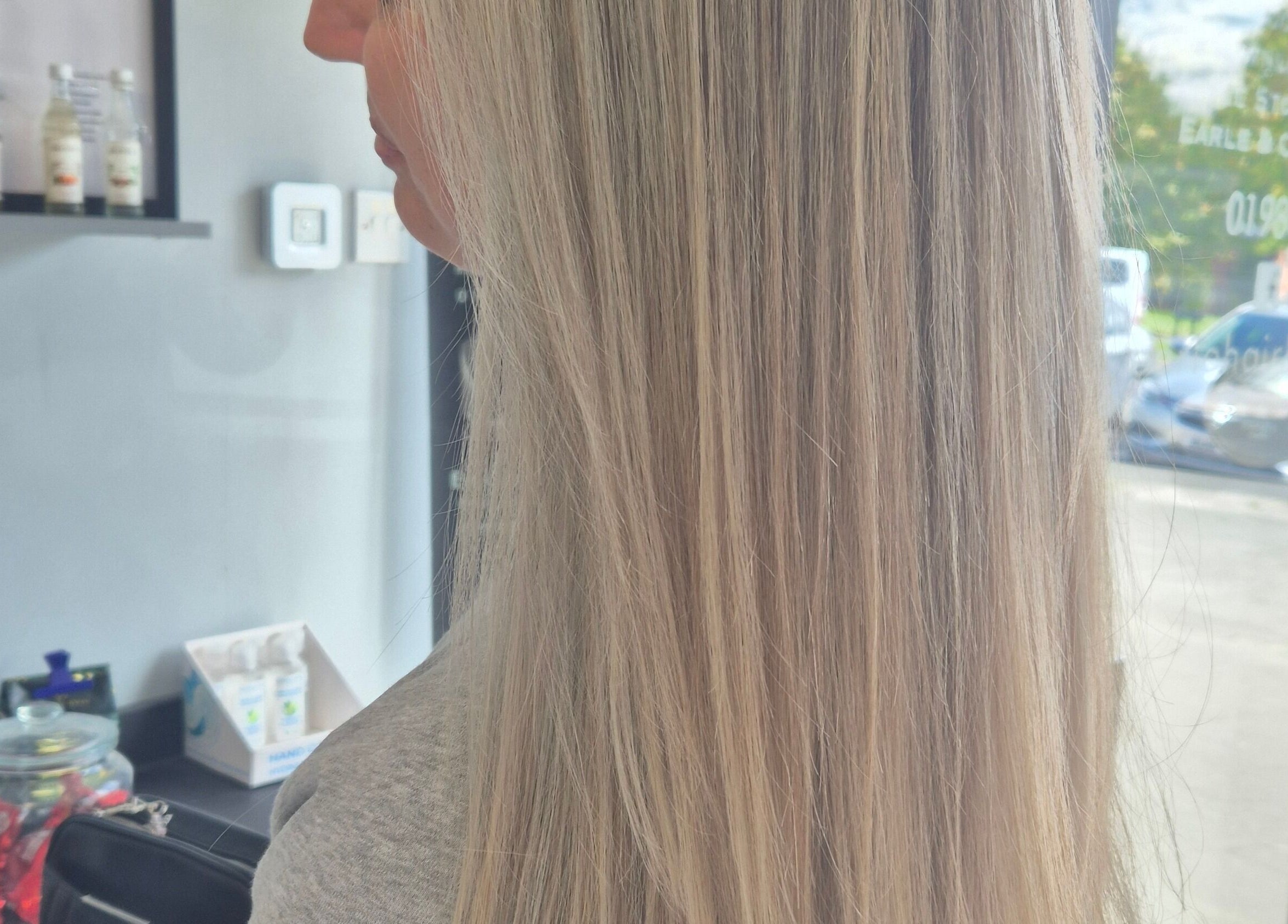 Elegant blonde hair styling at Salon De Lyla, Ludgershall, England, GB. Beautifully straightened and glossy finish.