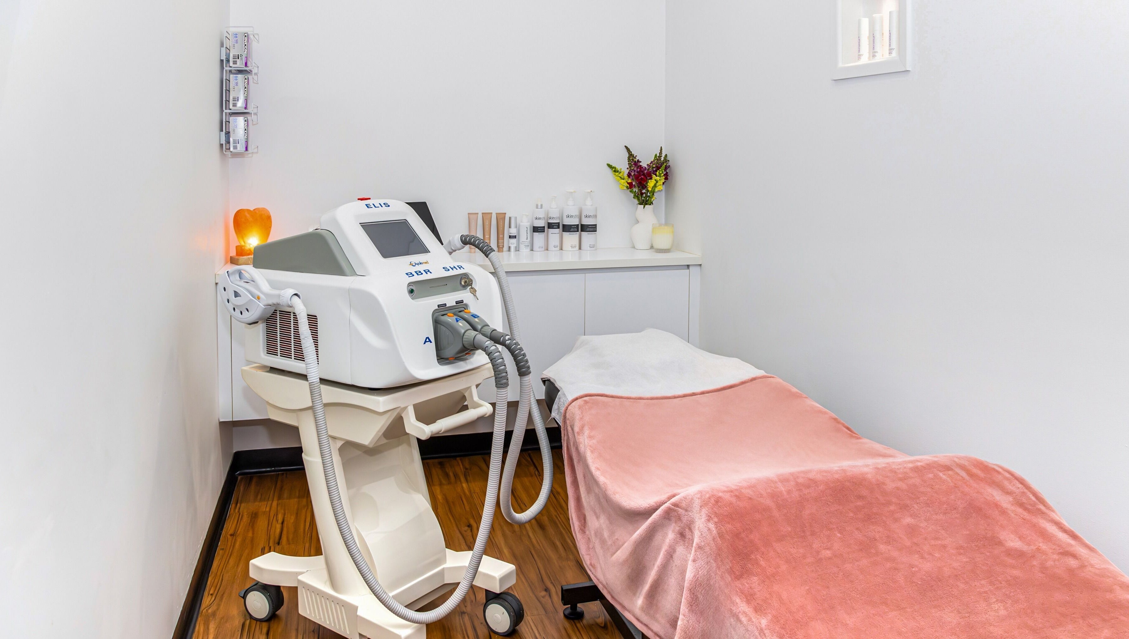 Relaxing treatment room at Face Magic Medispa in Coolangatta, Queensland, AU with equipment and cozy decor.