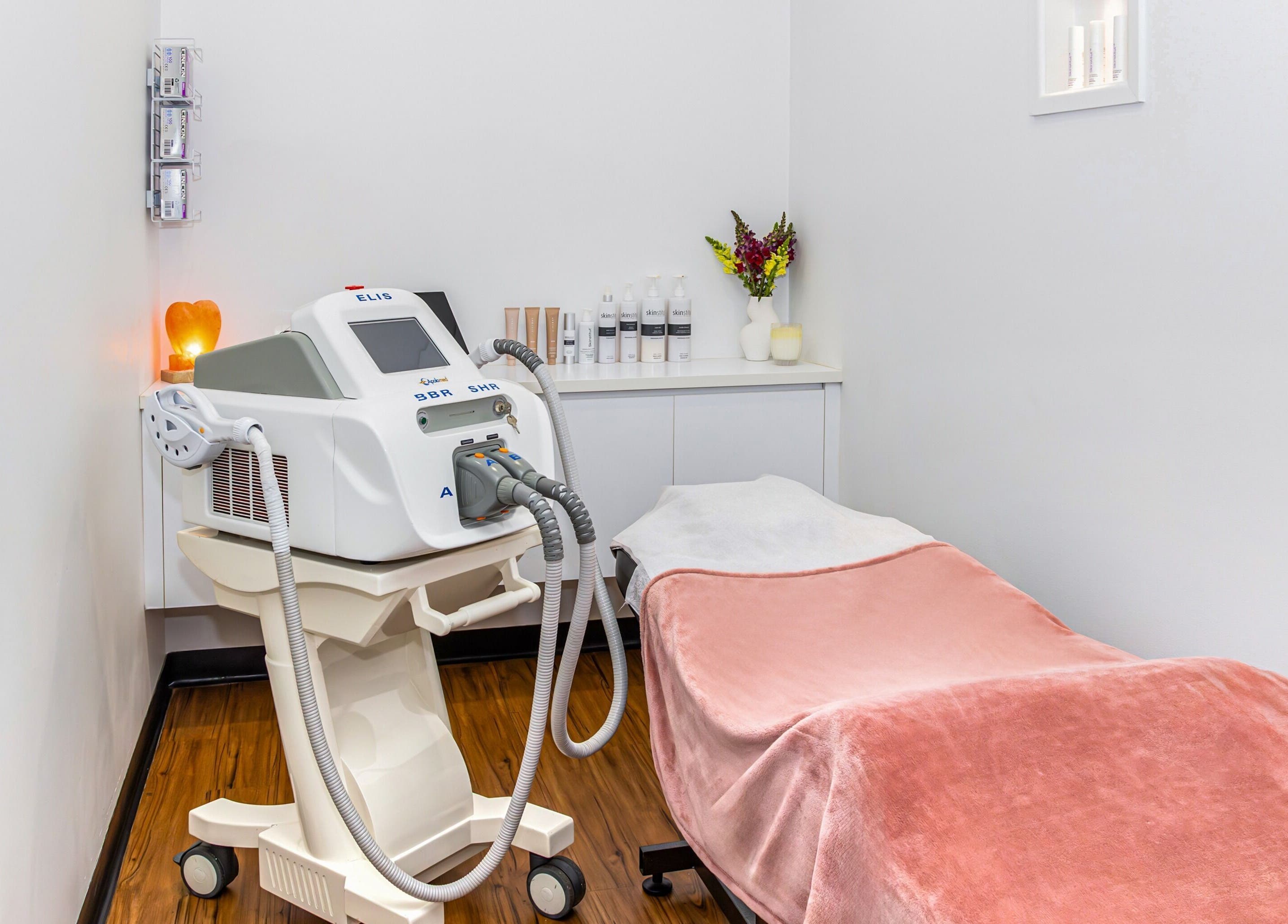 Relaxing treatment room at Face Magic Medispa in Coolangatta, Queensland, AU with equipment and cozy decor.
