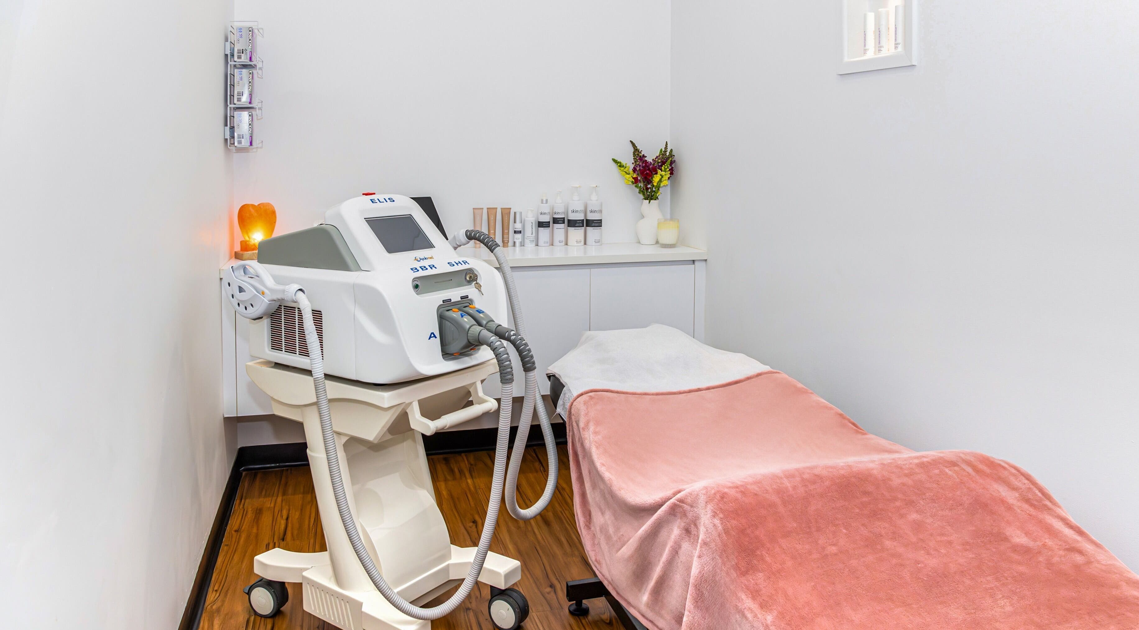 Relaxing treatment room at Face Magic Medispa in Coolangatta, Queensland, AU with equipment and cozy decor.