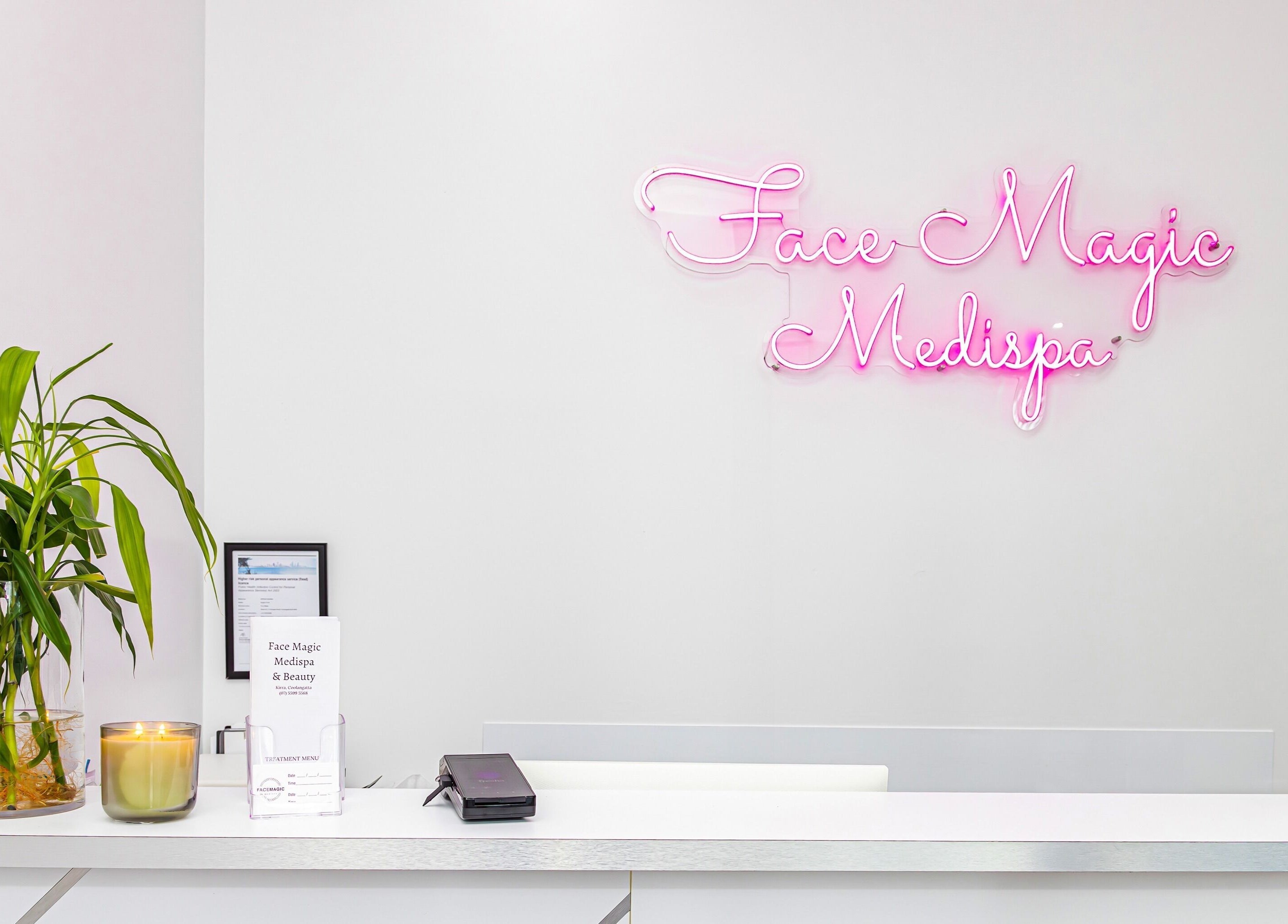 Reception at Face Magic Medispa, Coolangatta, Queensland, AU with neon sign and decor.