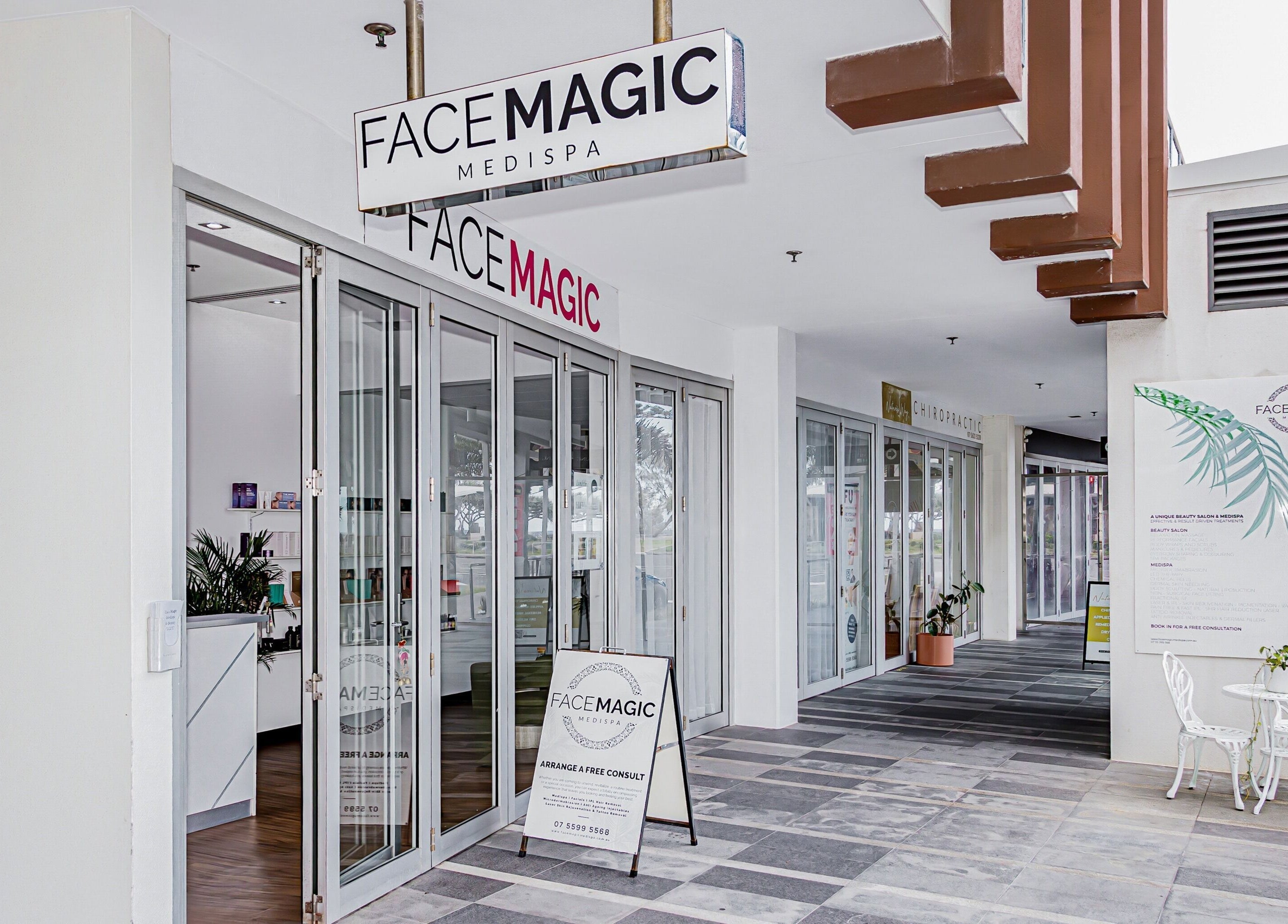 Entrance of Face Magic Medispa in Coolangatta, Queensland, AU with stylish signage and inviting decor.