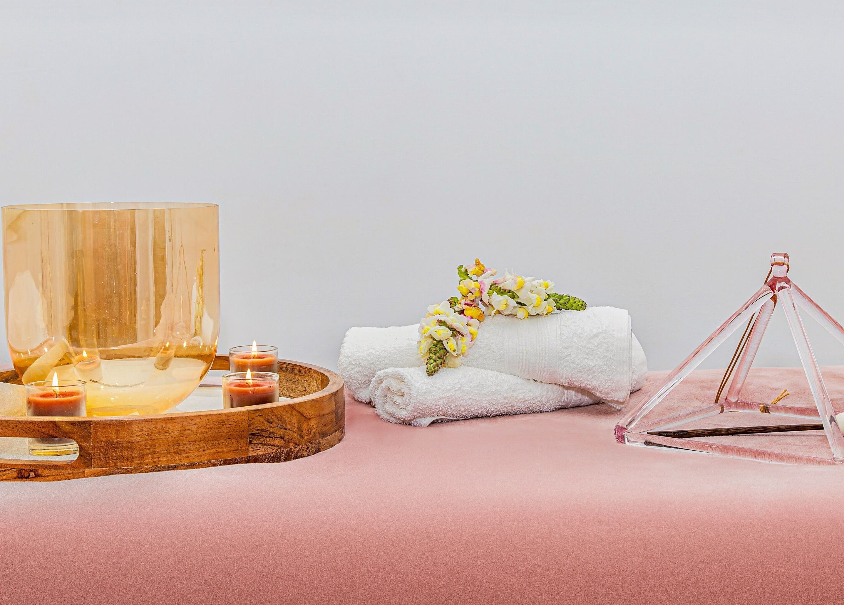 Relaxing wooden tray with candles and flowers at Face Magic Medispa, Coolangatta, Queensland, AU.
