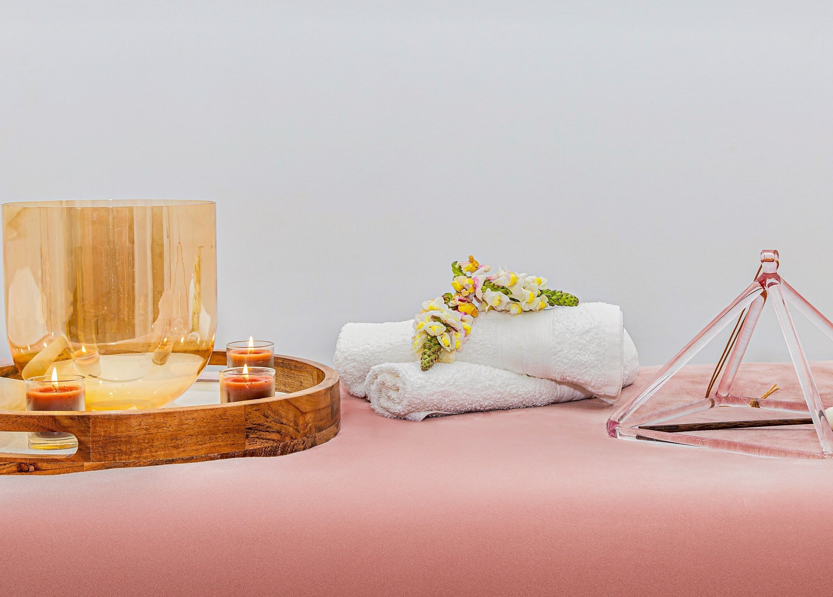 Relaxing wooden tray with candles and flowers at Face Magic Medispa, Coolangatta, Queensland, AU.