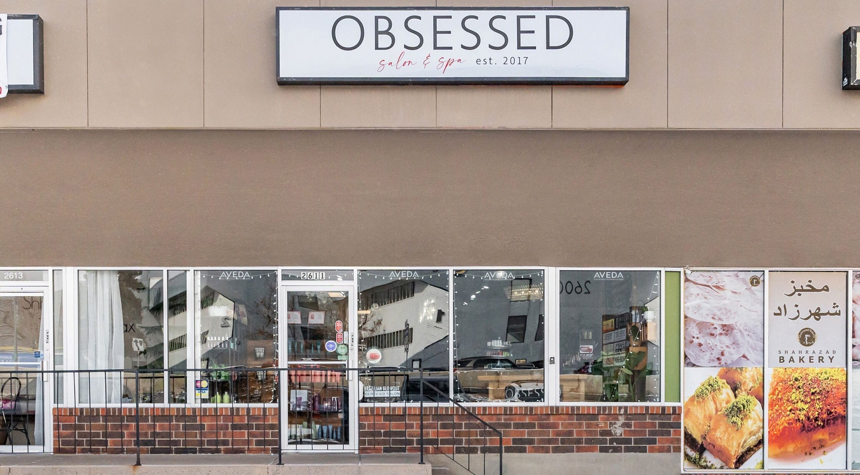 Front view of Obsessed Salon in Aurora, Colorado, US showcasing modern salon and spa entrance.
