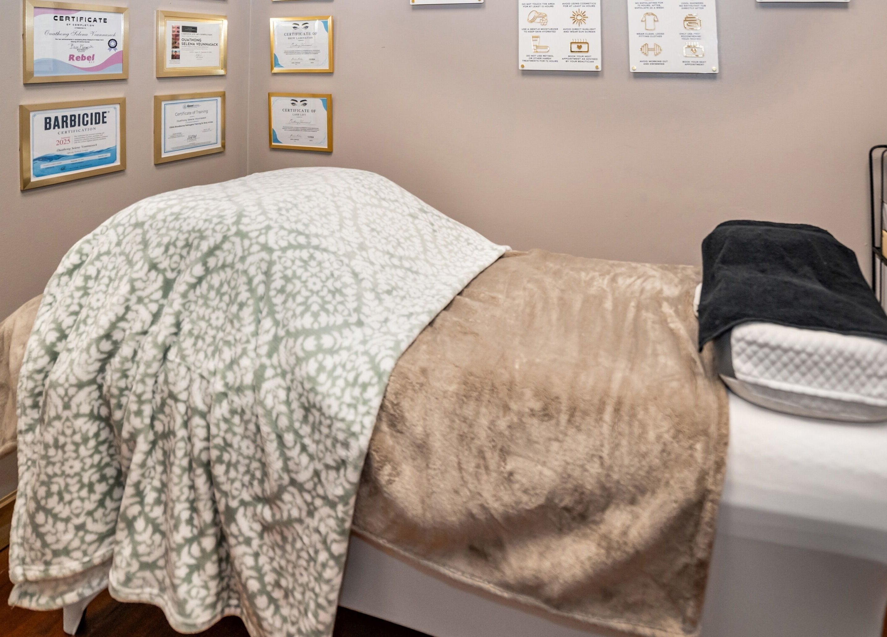 Relaxation bed in Obsessed Salon with certificates on the wall, Aurora, Colorado, US.