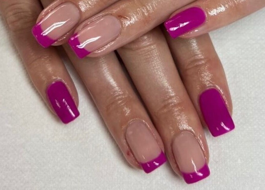 Manicured hands with vibrant pink nails at Pamper Me Pink, Cape Town, Western Cape, ZA.