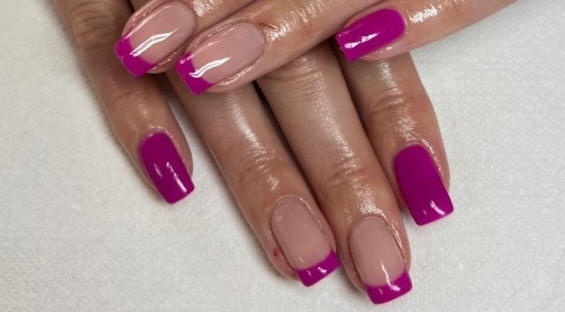 Manicured hands with vibrant pink nails at Pamper Me Pink, Cape Town, Western Cape, ZA.