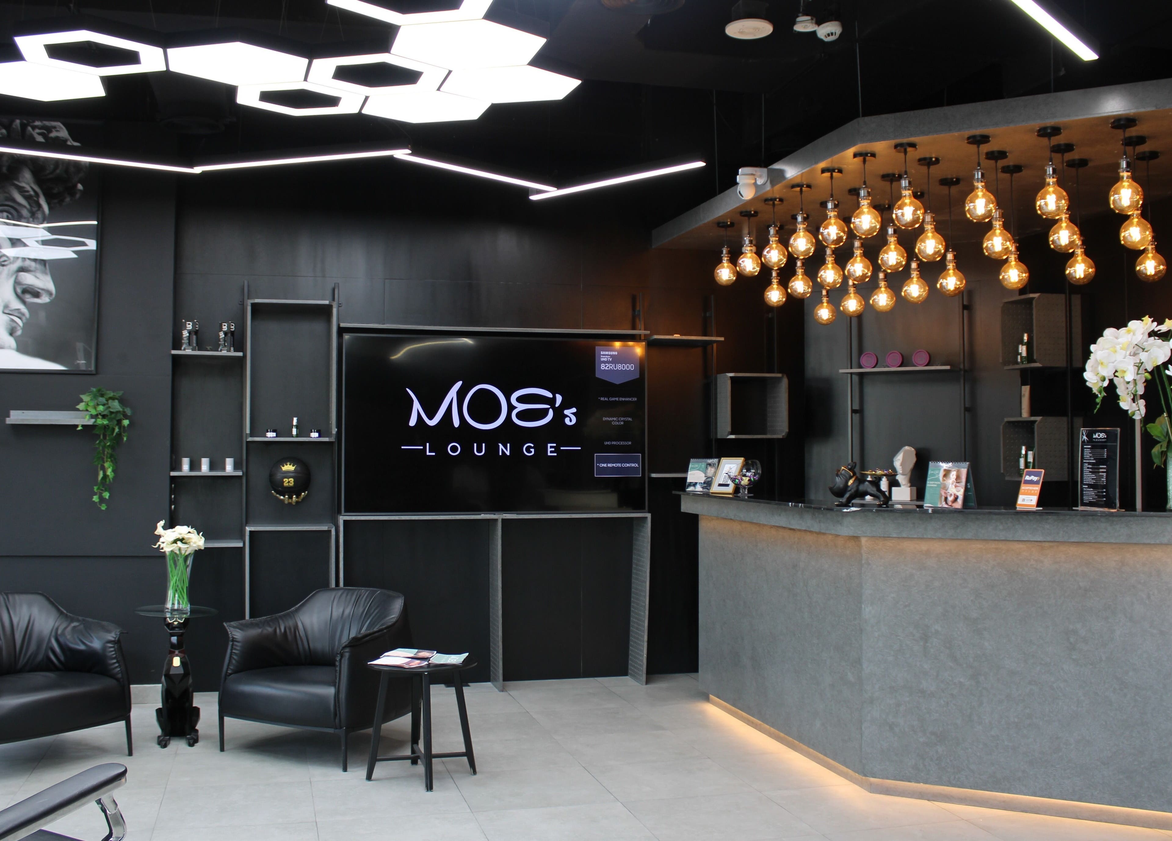 Chic interior of Moe's Lounge - Jumeirah Garden City, Dubai, AE with modern decor and ambient lighting.