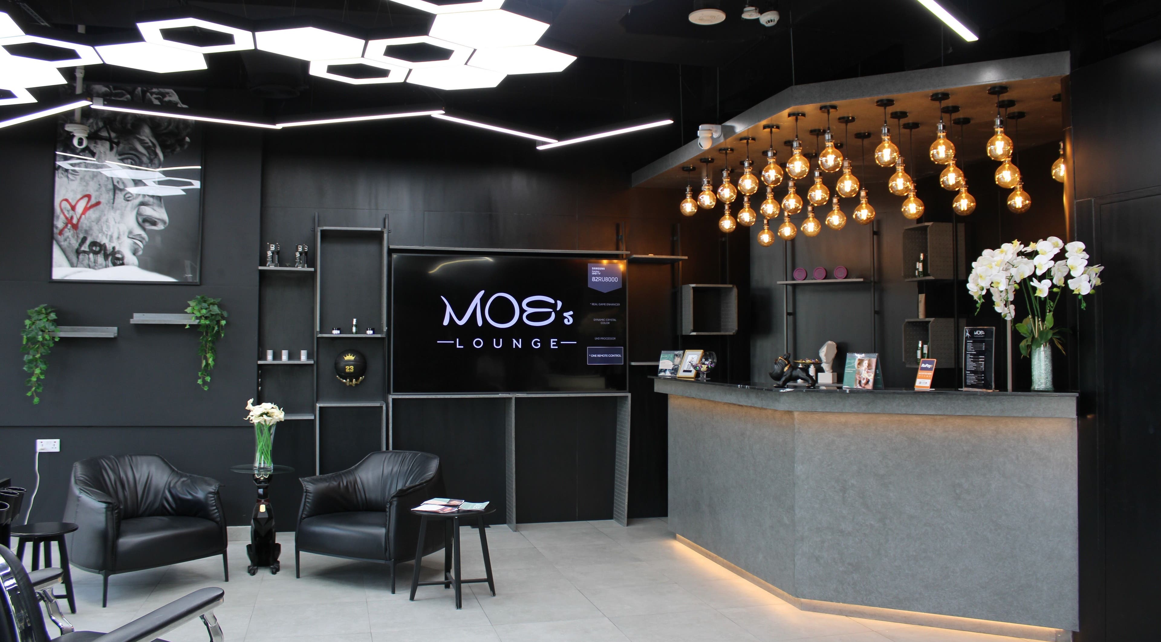 Chic interior of Moe's Lounge - Jumeirah Garden City, Dubai, AE with modern decor and ambient lighting.