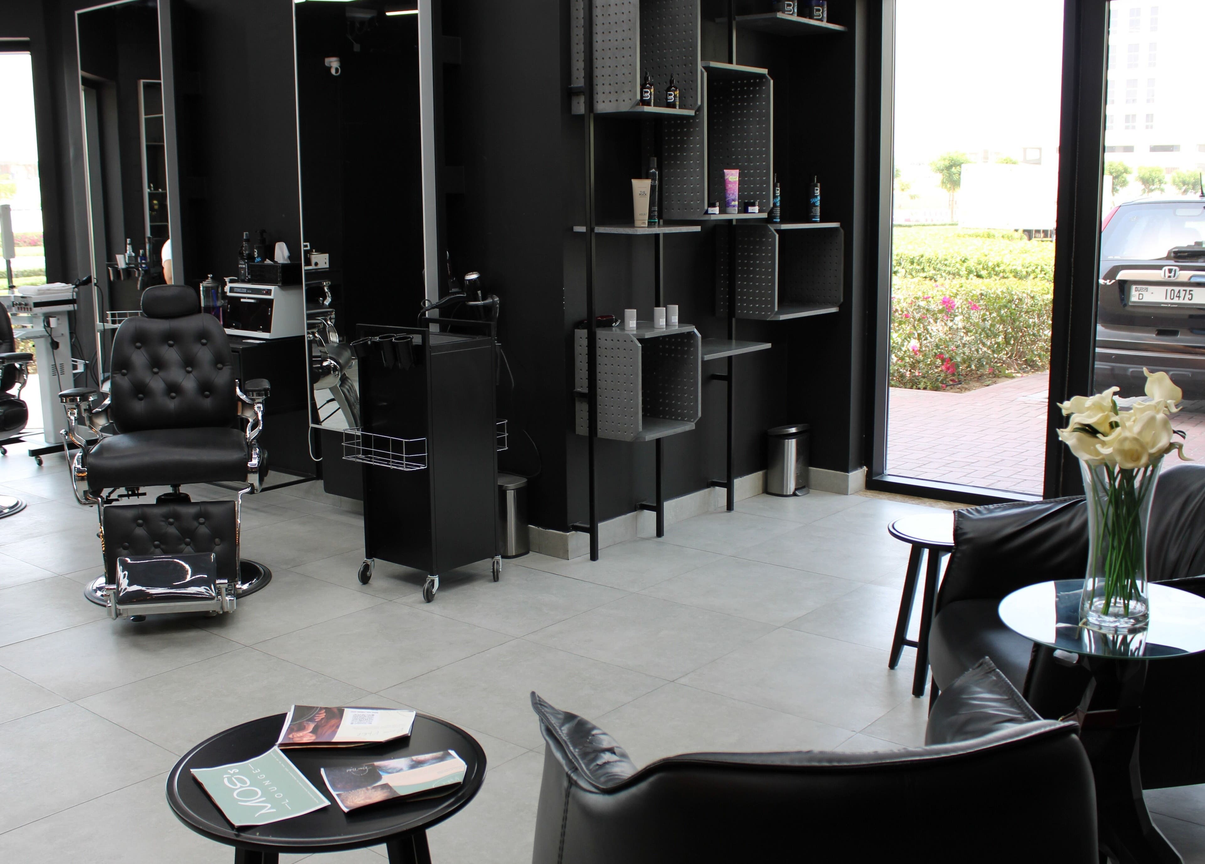 Modern interior at Moe's Lounge - Jumeirah Garden City, Dubai, AE featuring sleek chairs and stylish decor.