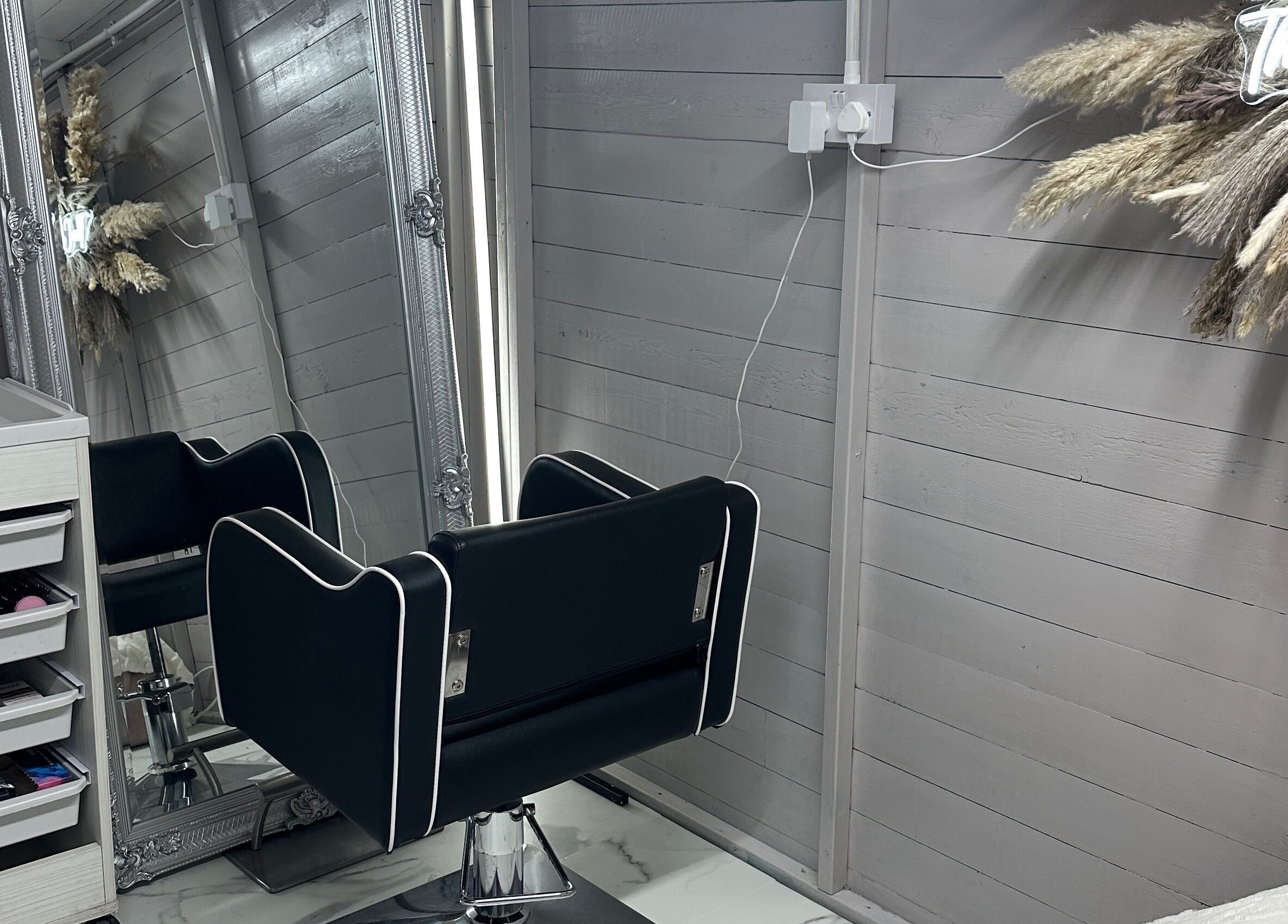 Elegant salon chair and mirror setup at TheCabinOfLuxxe, Bolton, England, GB.