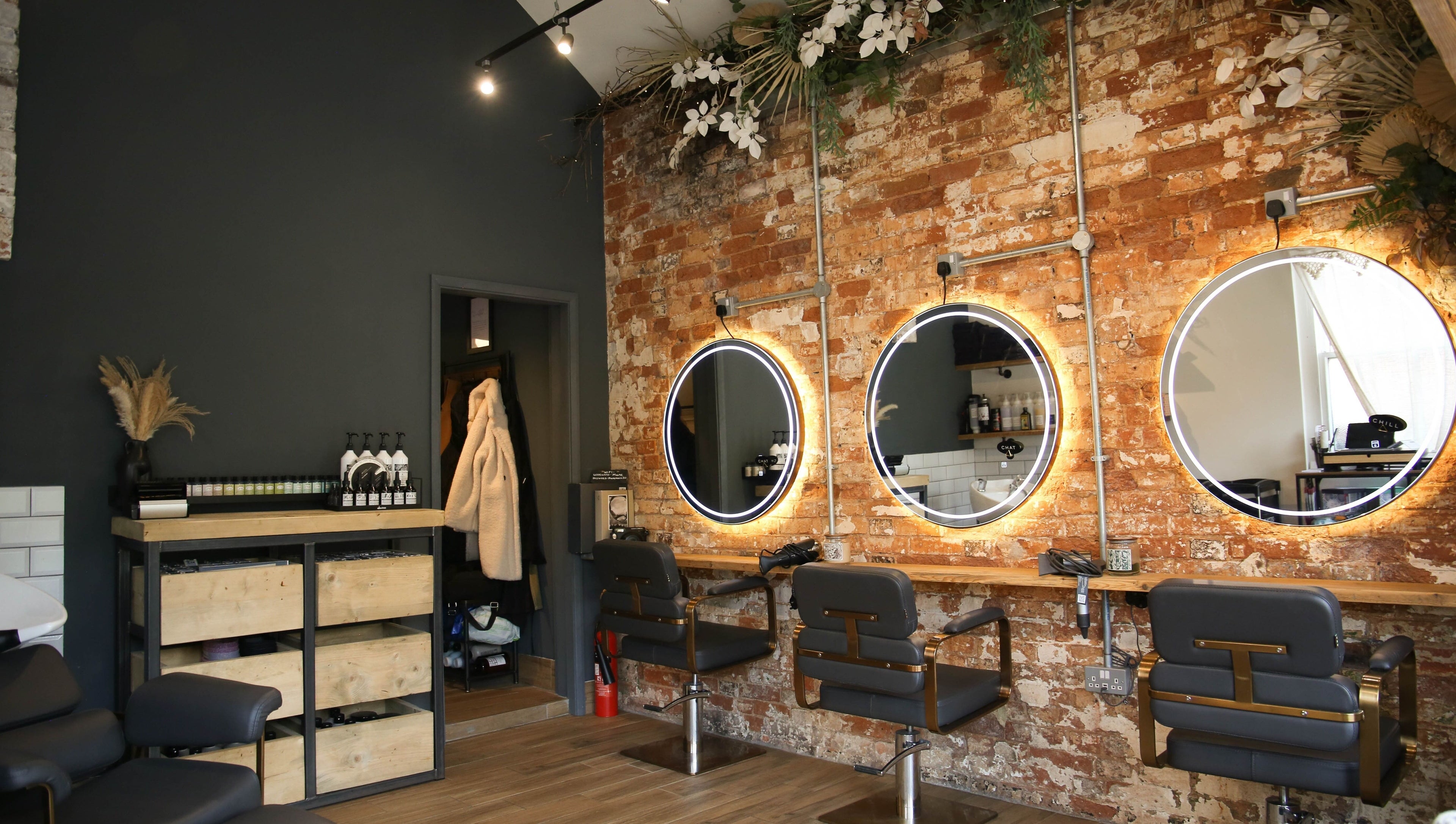 Stylish salon chairs and mirrors at Mane in Huncote, England, GB. Perfect ambiance for beauty treatments.