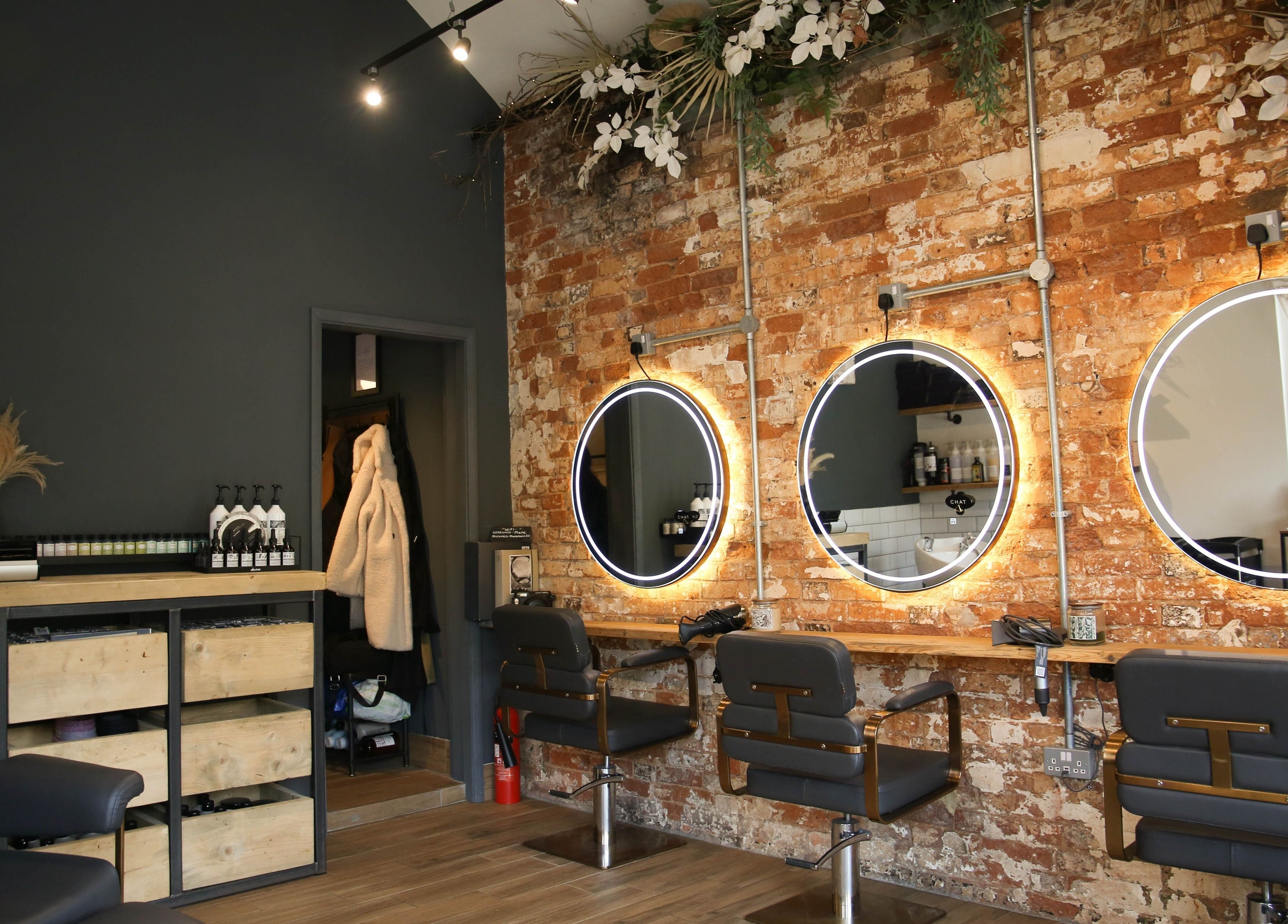 Stylish salon chairs and mirrors at Mane in Huncote, England, GB. Perfect ambiance for beauty treatments.