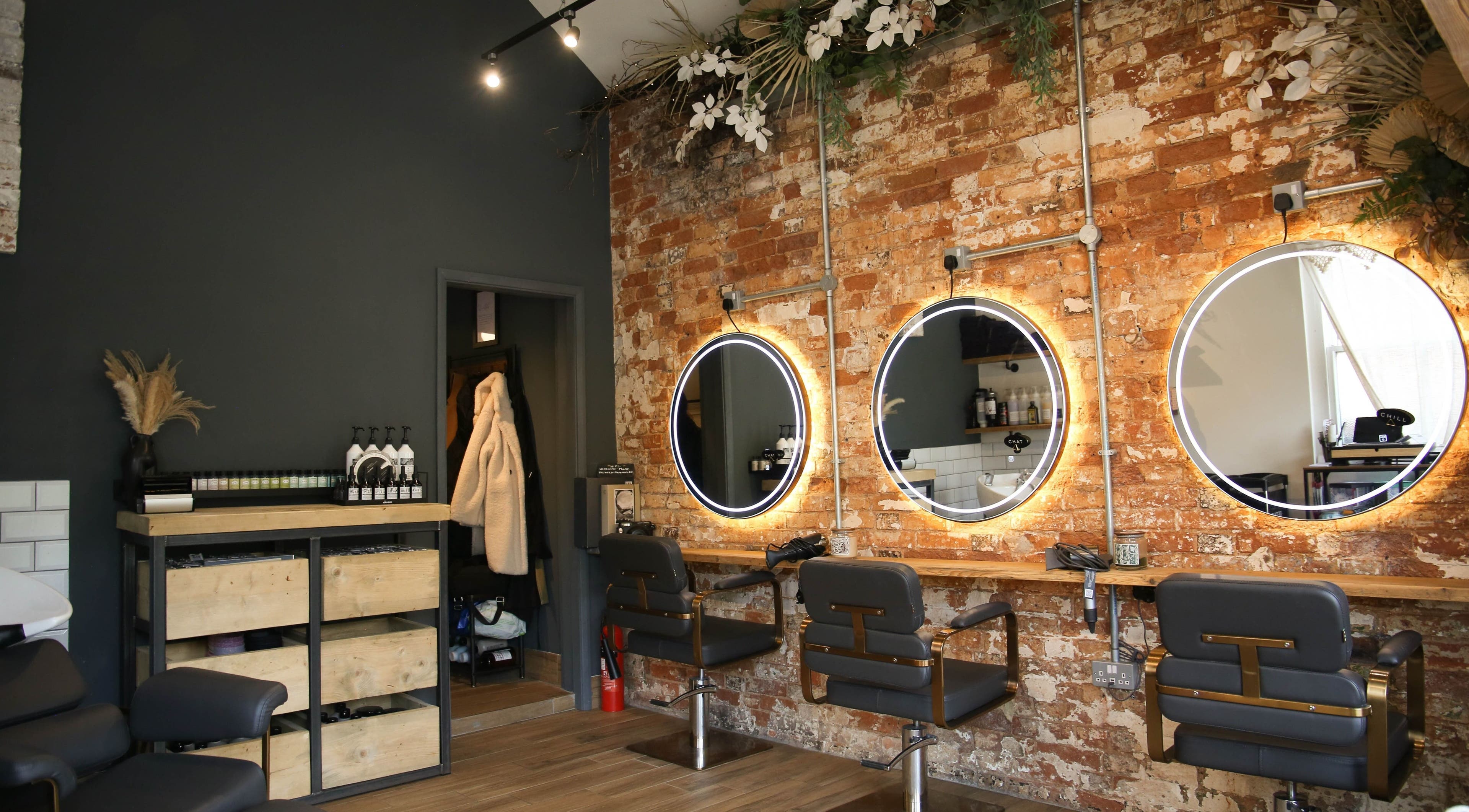 Stylish salon chairs and mirrors at Mane in Huncote, England, GB. Perfect ambiance for beauty treatments.
