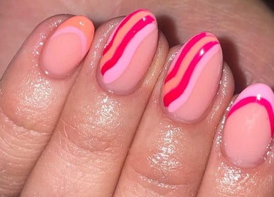 Vibrant pink and orange nail art at Ella Rose Nails, Witham, England, GB, showcasing intricate designs.
