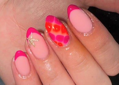 Colorful nail art at Ella Rose Nails, Witham, England, GB, featuring pink tips and floral designs.