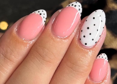 Stylish polka dot nail design at Ella Rose Nails, Witham, England, GB showcasing pink and white manicure.