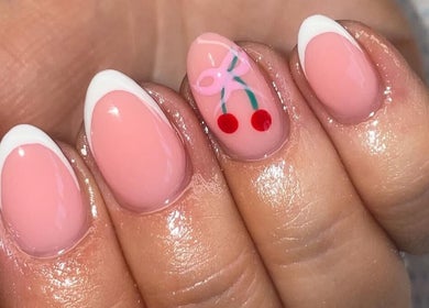 Stylish pink nails with cherry art from Ella Rose Nails in Witham, England, GB.