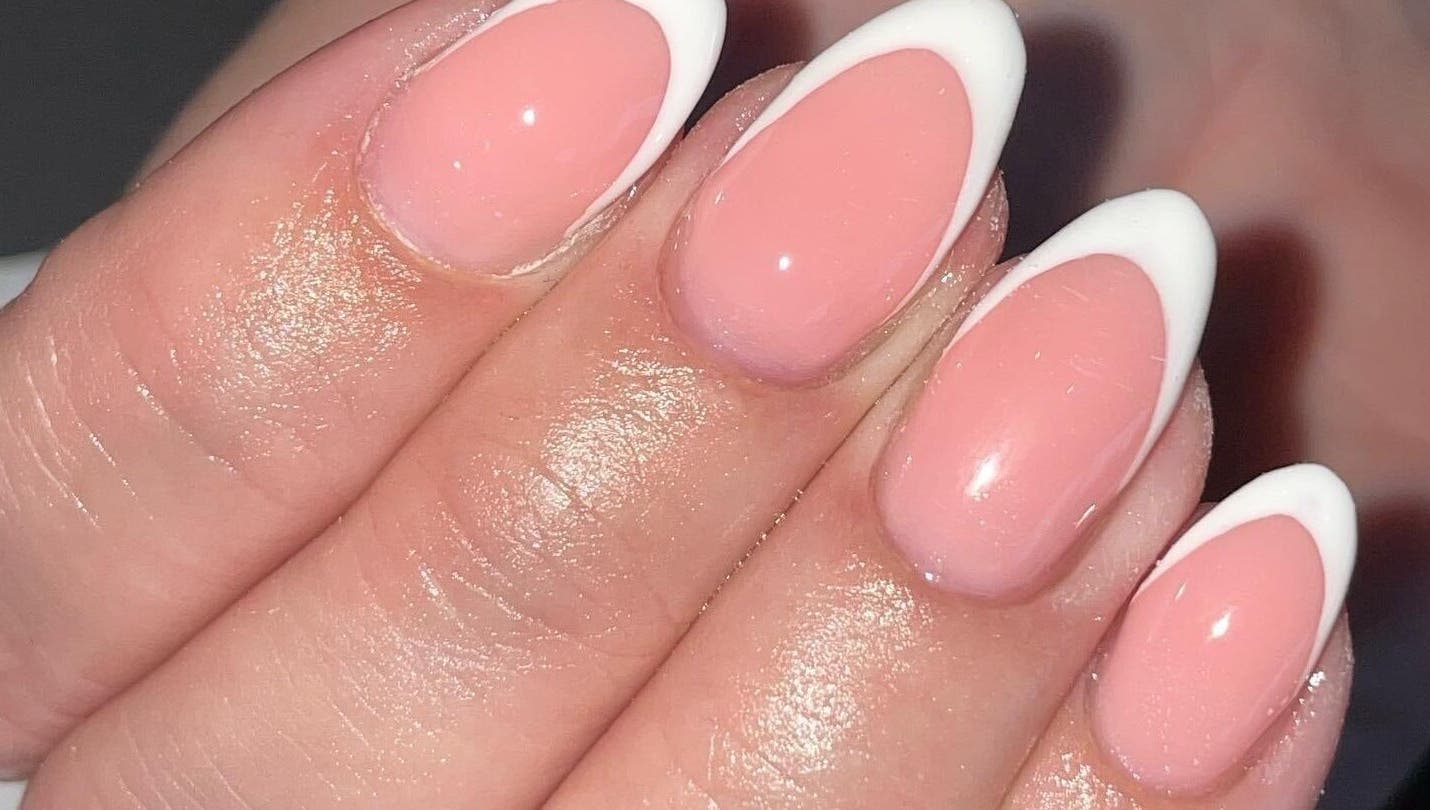 Close-up of French manicure at Ella Rose Nails, Witham, England, GB in soft pink and white.