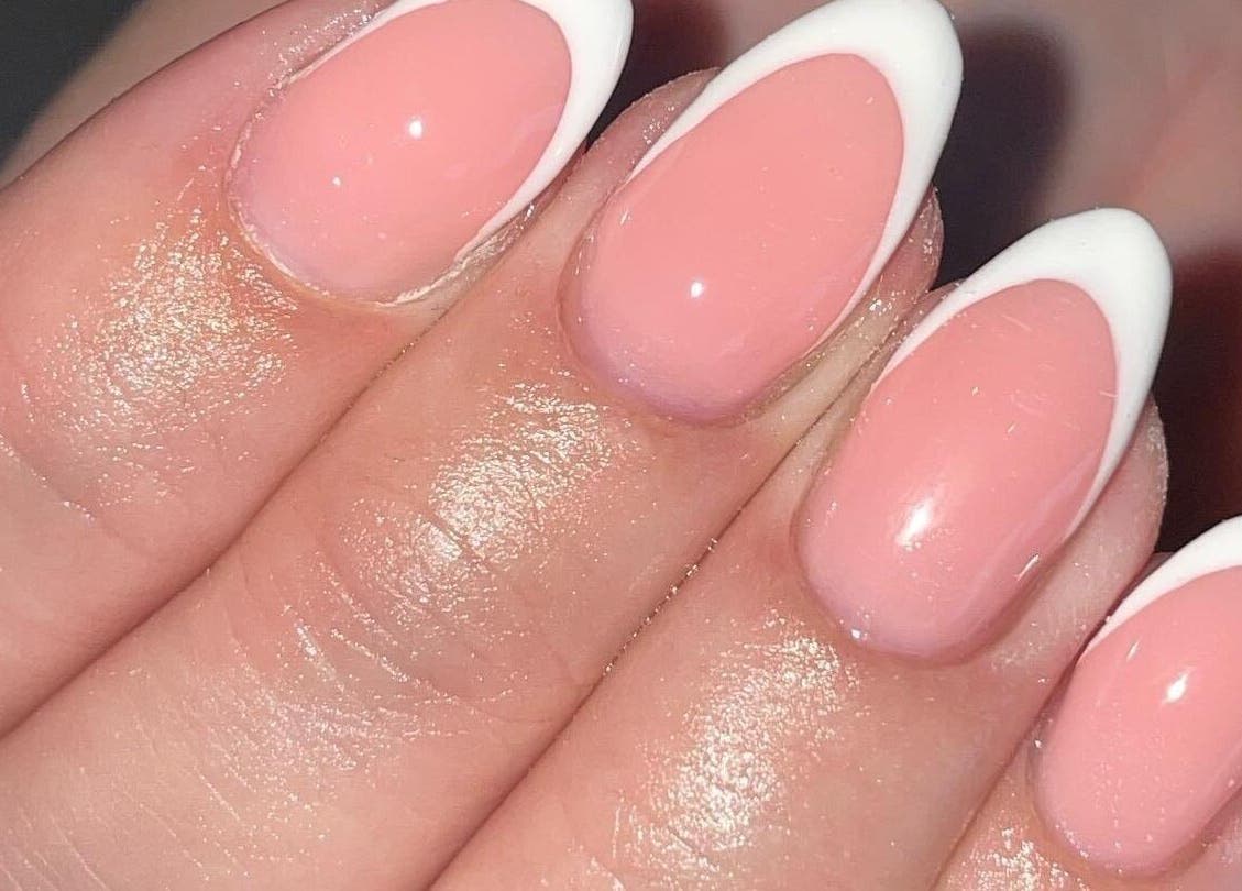 Close-up of French manicure at Ella Rose Nails, Witham, England, GB in soft pink and white.