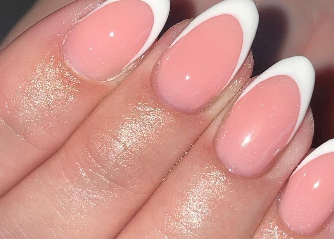 Close-up of French manicure at Ella Rose Nails, Witham, England, GB in soft pink and white.