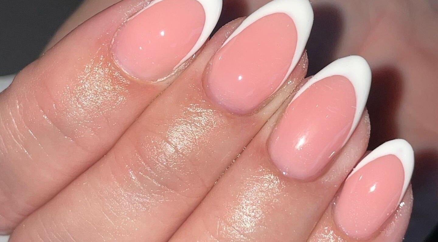 Close-up of French manicure at Ella Rose Nails, Witham, England, GB in soft pink and white.