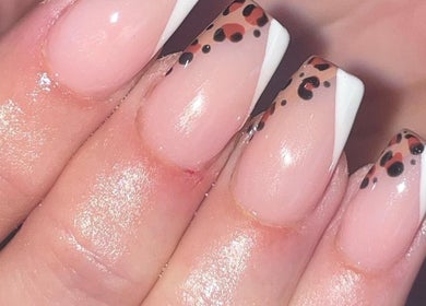 Elegant nude nails with leopard tips at Ella Rose Nails, Witham, England, GB.