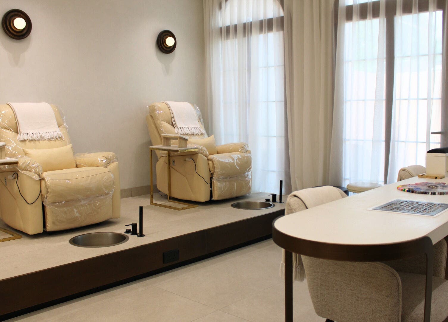 Elegant pedicure chairs at By Mikas Beauty Salon - Sole Proprietorship L.L.C., Abu Dhabi, Abu Dhabi, AE.