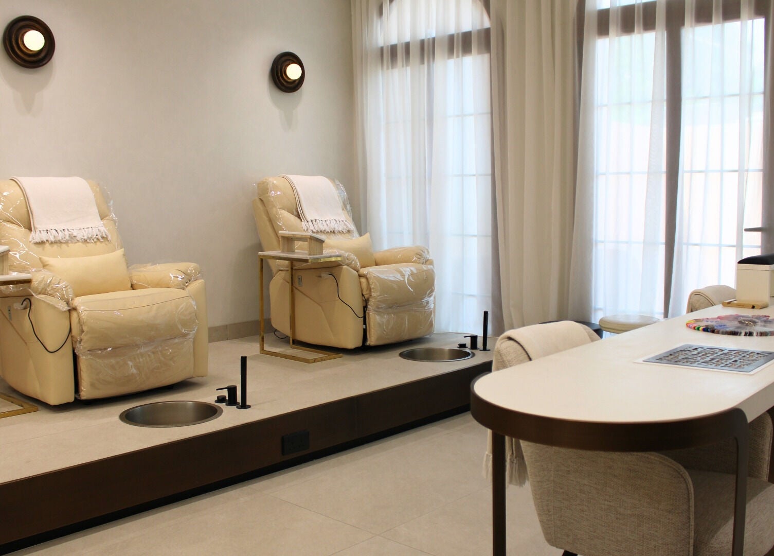 Elegant pedicure chairs at By Mikas Beauty Salon - Sole Proprietorship L.L.C., Abu Dhabi, Abu Dhabi, AE.