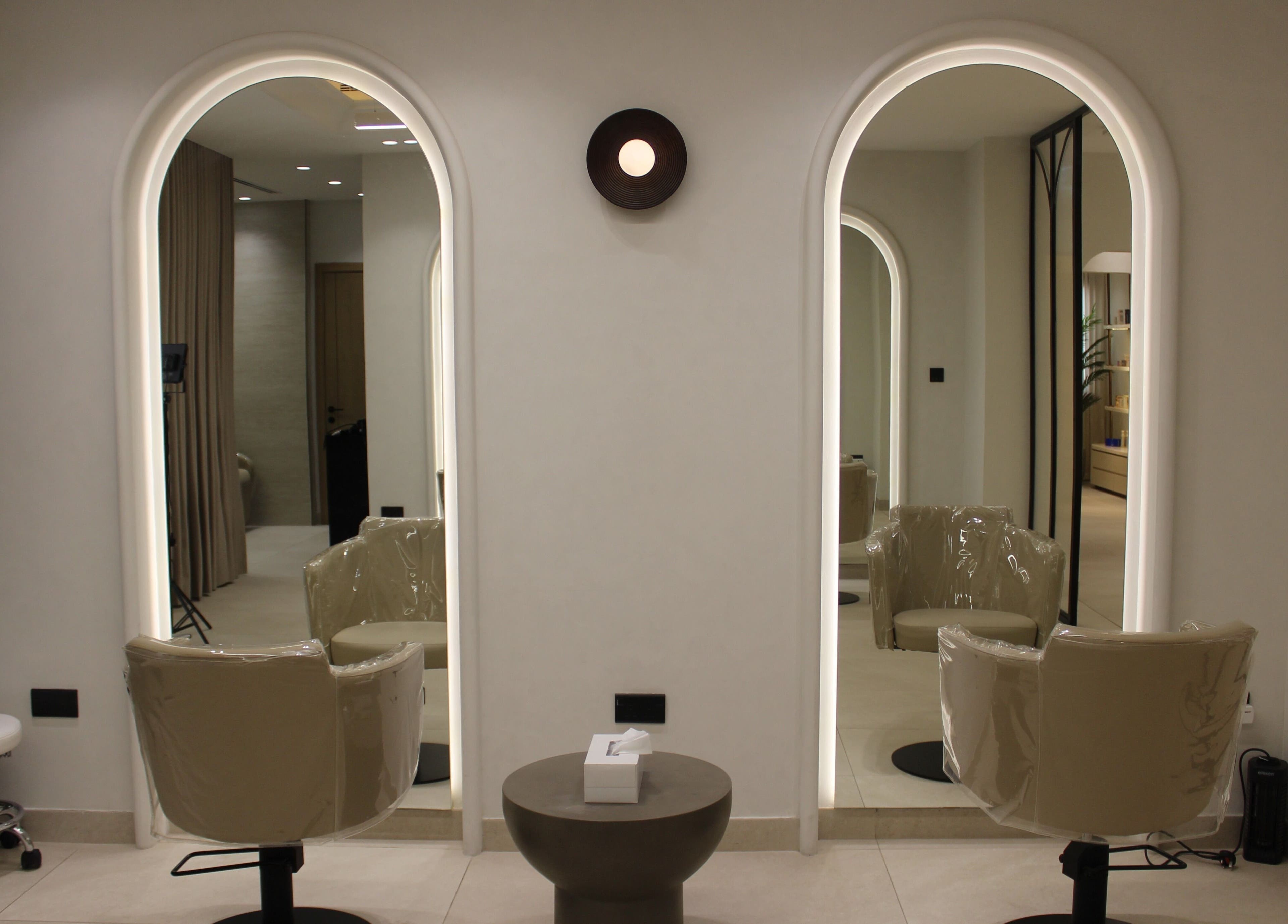 Stylish salon chairs and mirrors at By Mikas Beauty Salon - Sole Proprietorship L.L.C., Abu Dhabi, Abu Dhabi, AE.