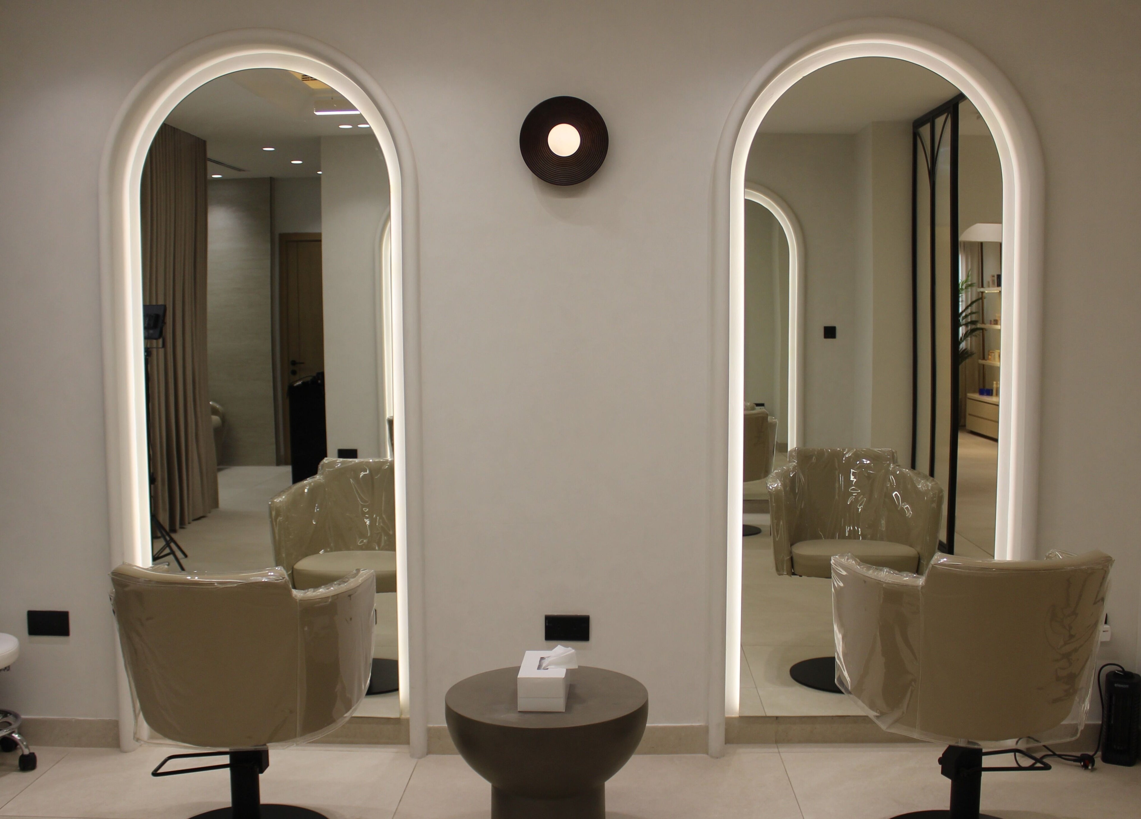 Stylish salon chairs and mirrors at By Mikas Beauty Salon - Sole Proprietorship L.L.C., Abu Dhabi, Abu Dhabi, AE.