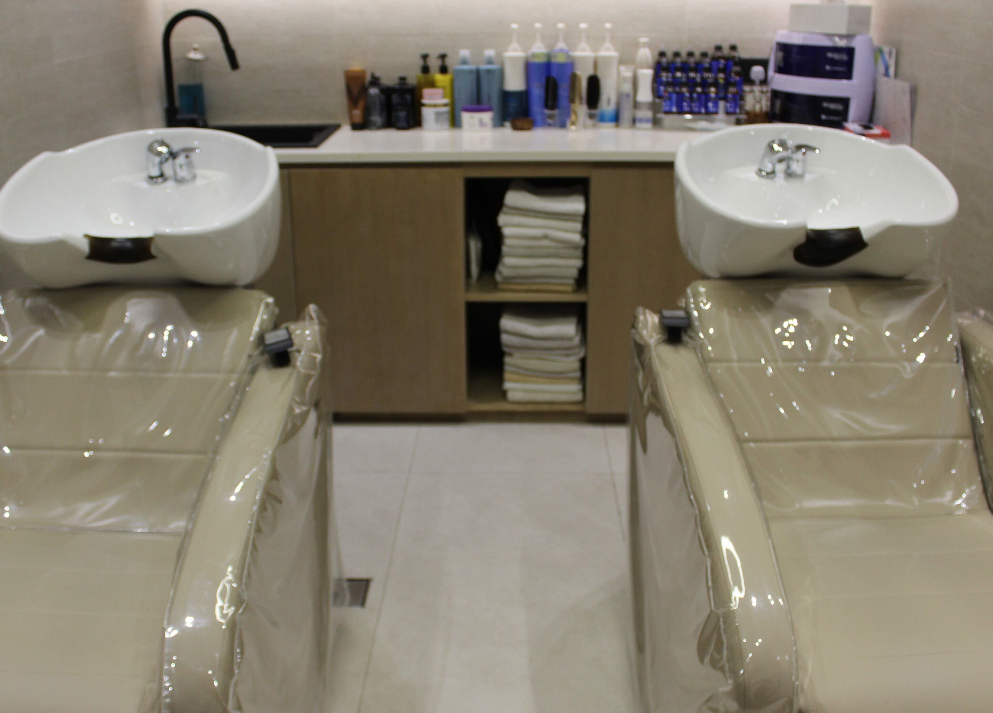 Modern wash stations at By Mikas Beauty Salon - Sole Proprietorship L.L.C., Abu Dhabi, Abu Dhabi, AE.
